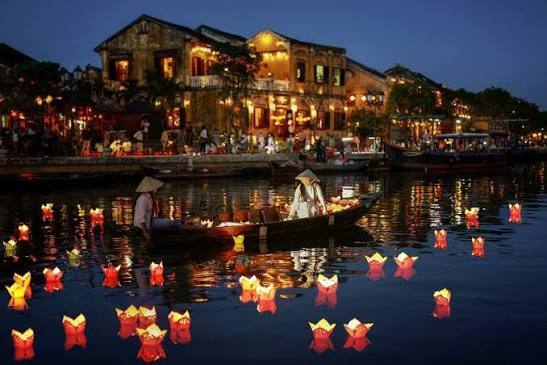 Traditional bamboo basket boats in a coconut palm waterway